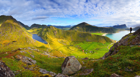 Sunny norwegian landscape. View at Norway mountains in the warm sunny evening. Green valley and mountain lake at the sunset.の写真素材