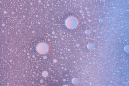 Abstract foam bubble texture on violet water background