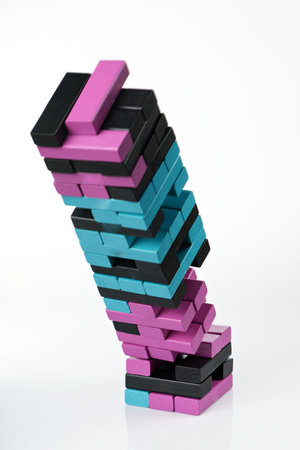 Falling wooden brick tower. Danger theme concept