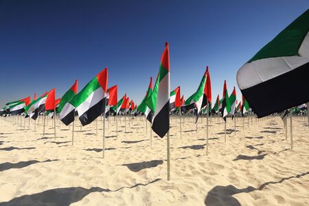 Flags of UAE on beach on UAE flag day close-upの写真素材
