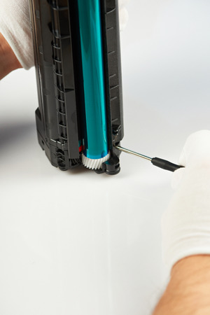 Repairing printer catridge theme. Checking laser toner printerの写真素材