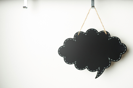 Cloud tag for text hanging on hook white backgroundの写真素材