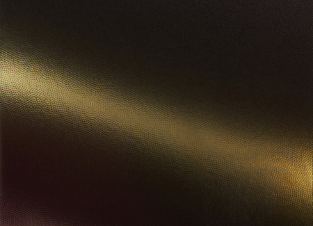 Metal golden mesh background with dots. Perforated metallic textureの写真素材
