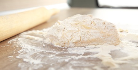 Dough on white flour close-up. Baking background.の写真素材