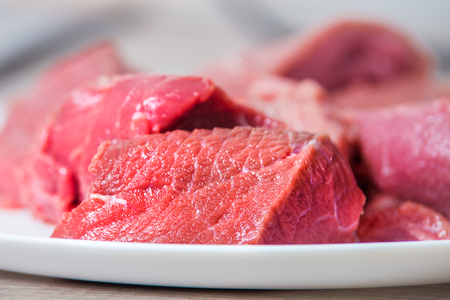 Sliced fresh raw beef meat on plate close-upの写真素材