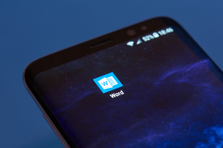 New york, USA - February 13, 2018: Microsoft word applications icon on smartphone screen close-up. Microsoft word icon with copy space on screenのeditorial素材