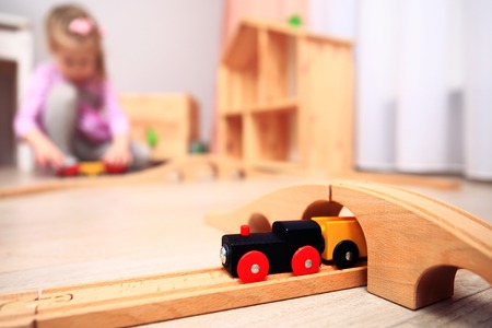 Playroom background. Toy colorful train on playing child backdrop.の写真素材
