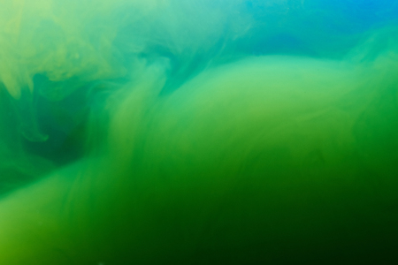 Abstract liquid green and blue background. Mixed ink patternの写真素材