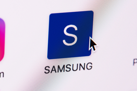 New york, USA - March 8, 2018: Opening Samsung web page on laptop screen close-up. Cursor on computer iconのeditorial素材