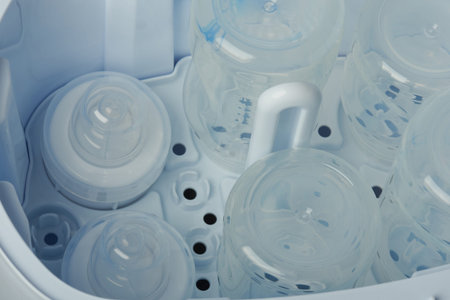 Clean part of  plastic bottles in sterilizing machine