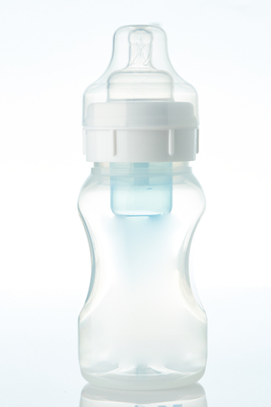 Clear bottle with nipple isolated on white backgroundの写真素材