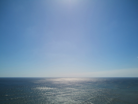 Ocean seascape on sunny day with clear blue skyの写真素材