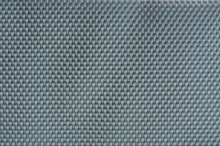 Blue material fabric background. Gray surface of fiber texture