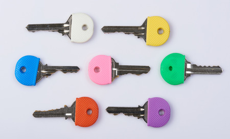 Colorful keys theme. Metal modern keys isolated on white backgroundの写真素材