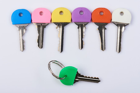 Copy of metal lock keys theme. Colorful keys isolated on white backgroundの写真素材