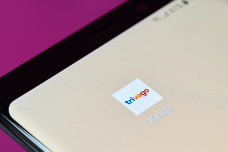 New york, USA - June 10, 2018: Trivago booking app icon on android smartphone screen close up viewのeditorial素材