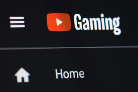 New york, USA - July 5, 2018: Youtube for game site on laptop screen background close up viewのeditorial素材