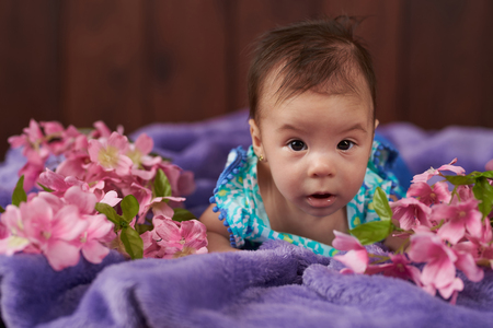 Portrait of little baby girl looking on cameraの写真素材
