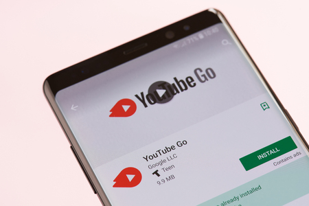 New york, USA - september 21, 2018: Youtube Go application on smartphone screen background close up viewのeditorial素材