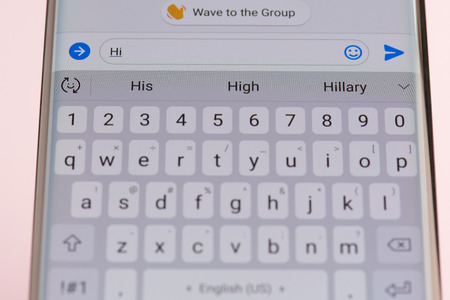 New york, USA - september 21, 2018: Texting Hi in facebook  messsanger on smartphone screen background close up viewのeditorial素材