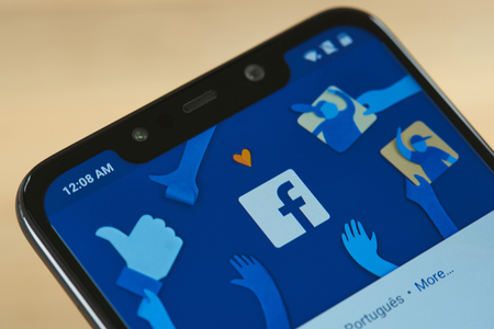 New york, USA - september 24, 2018: Facebook menu with icon on smartphone screen close upのeditorial素材