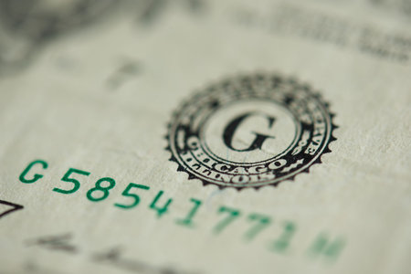 Stamp with green number on dollar banknote close up view