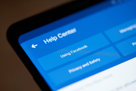 New york, USA - october 4, 2018: Help center in facebook on smartphone screen close up view