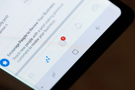 New york, USA - october 4, 2018: Facebook statistic  on smartphone screen close up viewのeditorial素材