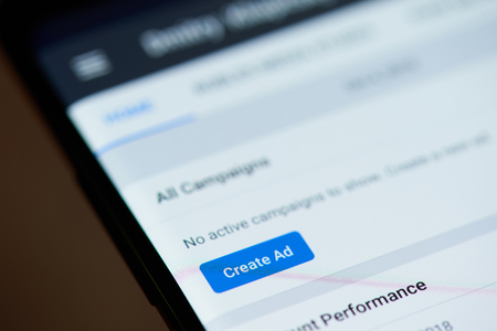 New york, USA - october 4, 2018: Create ad in facebook page on smartphone screen close up viewのeditorial素材
