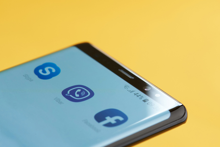 New york, USA - october 3, 2018: Viber icon app on smartphone screen close up view with yellow backgroundのeditorial素材