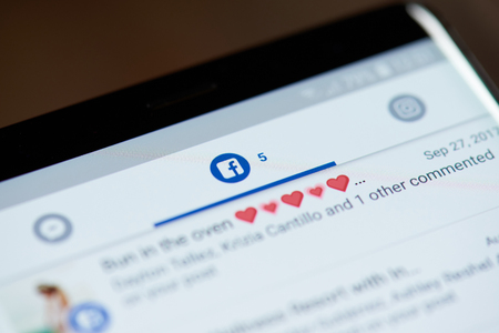 New york, USA - october 4, 2018: Facebook notification  on smartphone screen close up viewのeditorial素材