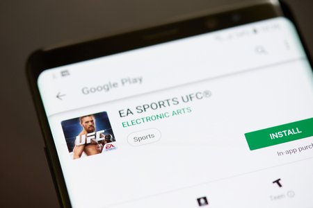 New york, USA - october 8, 2018: Ufc sport game app on smartphone screen close up viewのeditorial素材