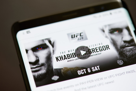 New york, USA - october 8, 2018: Ufc 229 fight video on smartphone screen close up viewのeditorial素材