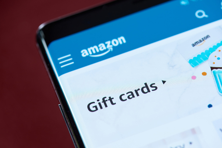 New york, USA - November 1, 2018: Amazon gift cards on smartphone screen close up viewのeditorial素材