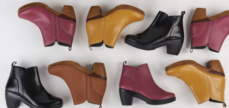 Woman footwear theme. Colorful color leather womans shoes isolated top view