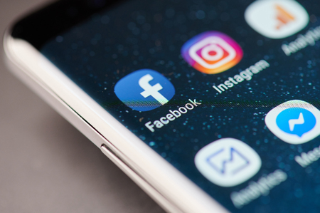 New york, USA - January 24, 2019: facebook app icon on smartphone screen close up viewのeditorial素材