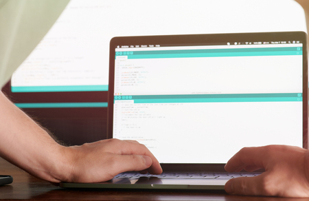 Woking on web application code. Man working as programmerの写真素材