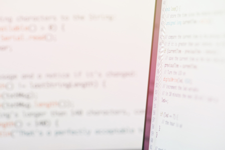 Computer code background. Laptop screen with coding linesの写真素材