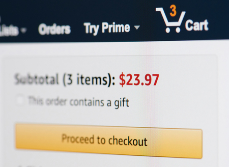 New york, USA - march 15, 2019: Amazon shopping cart with items on laptop screen close up viewのeditorial素材