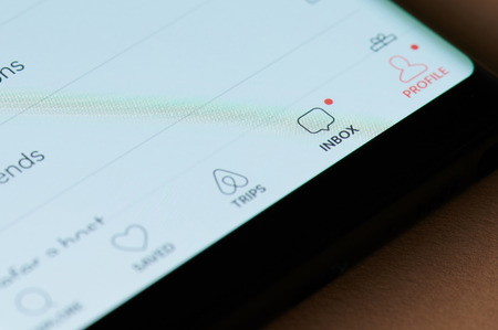 New york, USA - march 15, 2019: Inbox in airbnb application on smartphone screen close up viewのeditorial素材