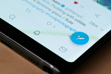 New york, USA - march 15, 2019: Create twitter post on smartphone screen close up viewのeditorial素材