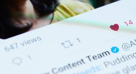 New york, USA - march 15, 2019: Likes in twitter post on smartphone screen close up viewのeditorial素材