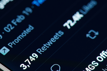 New york, USA - march 15, 2019: Retweets in twitter post on smartphone screen close up viewのeditorial素材