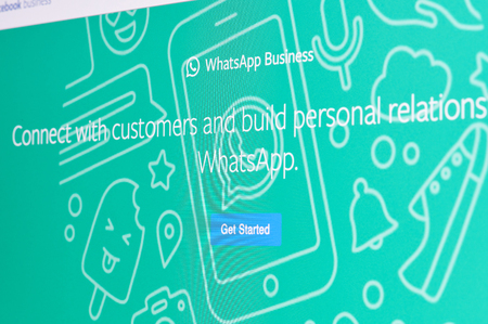 New york, USA - april 8, 2019: Whatsapp business get started on digital screen macro close up viewのeditorial素材