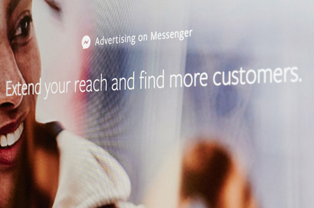 New york, USA - april 8, 2019: Advertising on facebook messenger on digital screen macro close up viewのeditorial素材