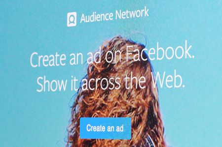 New york, USA - april 8, 2019: Create ad in audience network on digital screen macro close up viewのeditorial素材