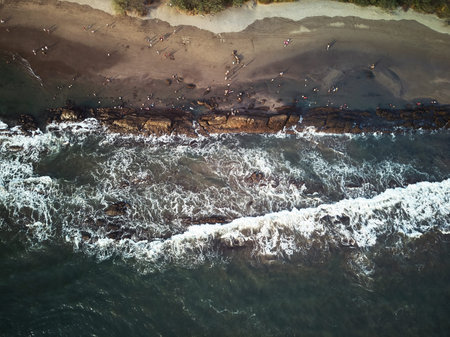 People having fun on beach above top view