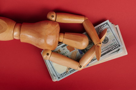 Man dreaming laying on 100 dollar bill close up viewの写真素材