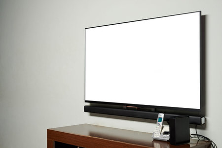 Tv panel on wall with phone and internet modem side view