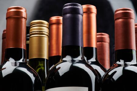 Different wine bottles close up view of stackの写真素材